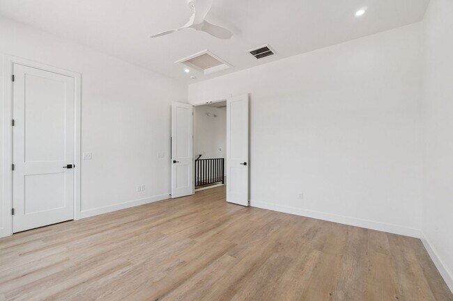 Building Photo - Bright. Clean. Calm. Your Elevated One-Bed...