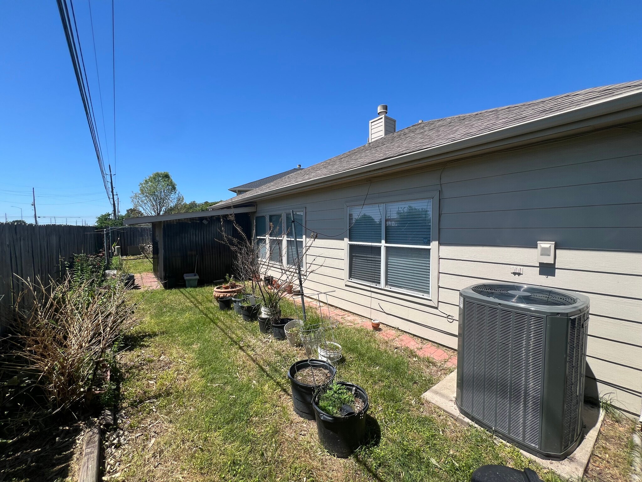 Backyard with greenhouse/patio - 21839 Manitou Falls Ln