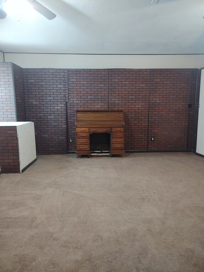 Large enclosed garage with storage closets galore! (*Desk not included) - 120 Arrow Lands Trl
