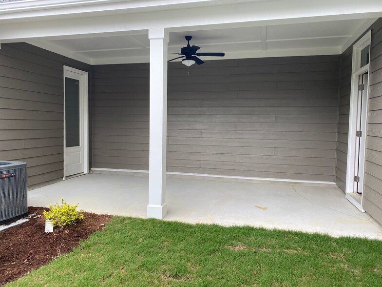 Back yard/door to garage - 729 Carraway Garden Dr