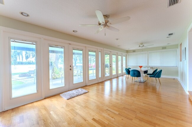 Building Photo - Lake Jessamine Luxury: Solar-Powered Waterfront Retreat on 1.14 Acres with Dock & Boathouse