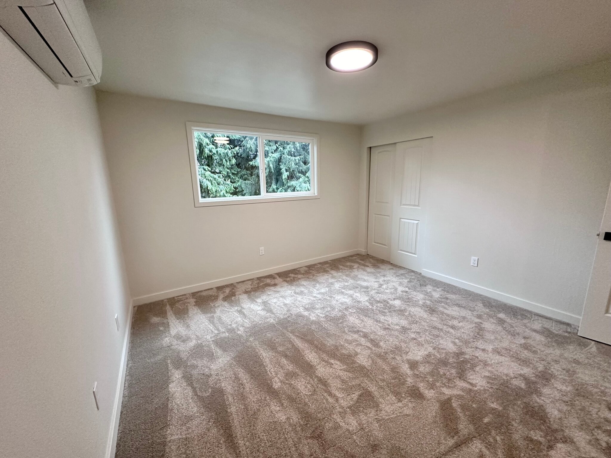 Bedroom 2 with new carpet, paint, split - 1014 W 23rd St