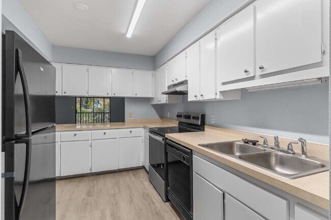 Building Photo - Freshly Updated 2BR Condo with Private Balcony, Community Pool, & In-Unit Laundry