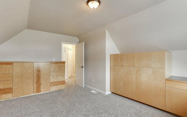 Building Photo - Spacious Four-Bedroom Home with Gourmet Kitchen, Multiple Living Areas, Loft, and Beautifully Lan...