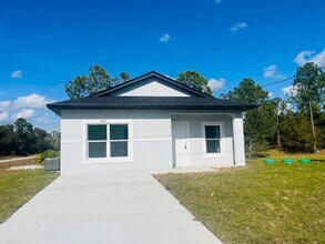 Building Photo - Brand New 2/2/1 - Lehigh Acres