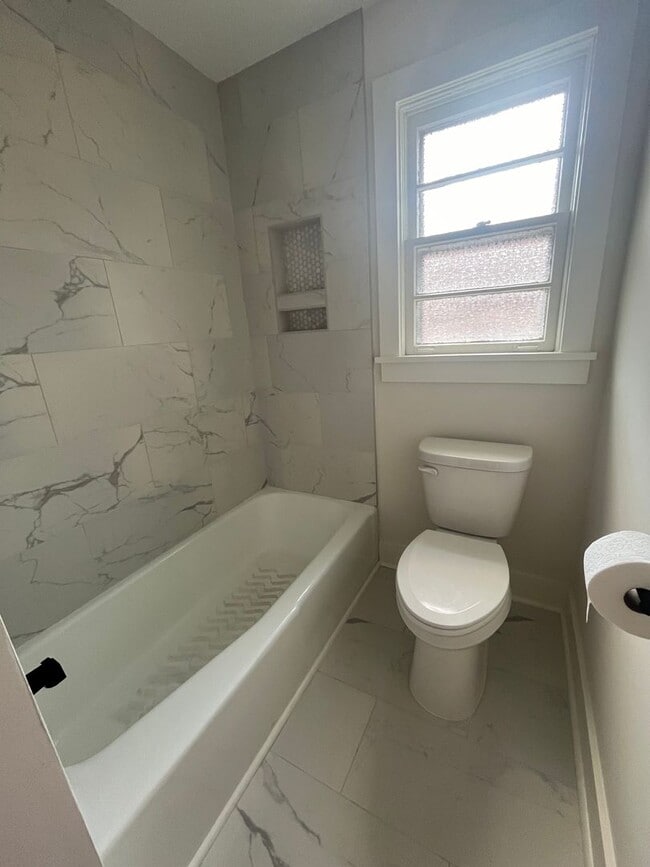 Building Photo - Fully Renovated 3BR/1.5BA – Prime Location + Lawn Care Included