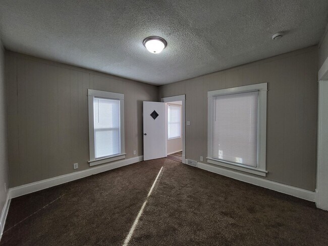 Building Photo - Two bedroom home with partially fenced yard!