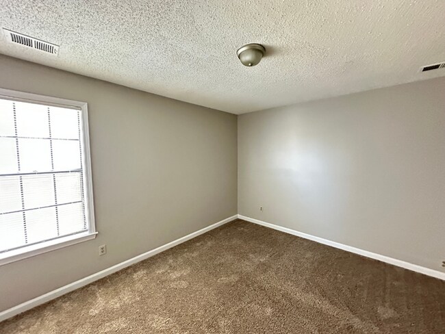 Building Photo - Grand 4BR/2BA Near Southwind | 2,438 Sq Ft, Stone Fireplace, Soaking Tub & 2-Car Garage