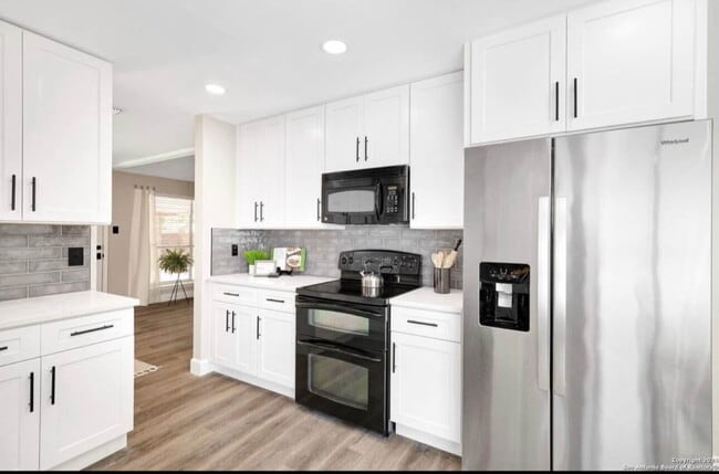 Building Photo - "Charming 4-Bedroom Home with Elegant Gran...