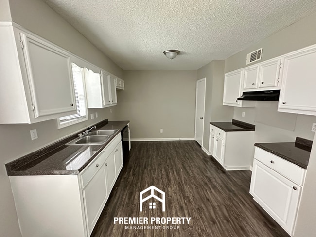 Building Photo - Quiet 3BR/2BA Cove Near Southwind | Soaring Ceilings & Floor-to-Ceiling Stone Fireplace