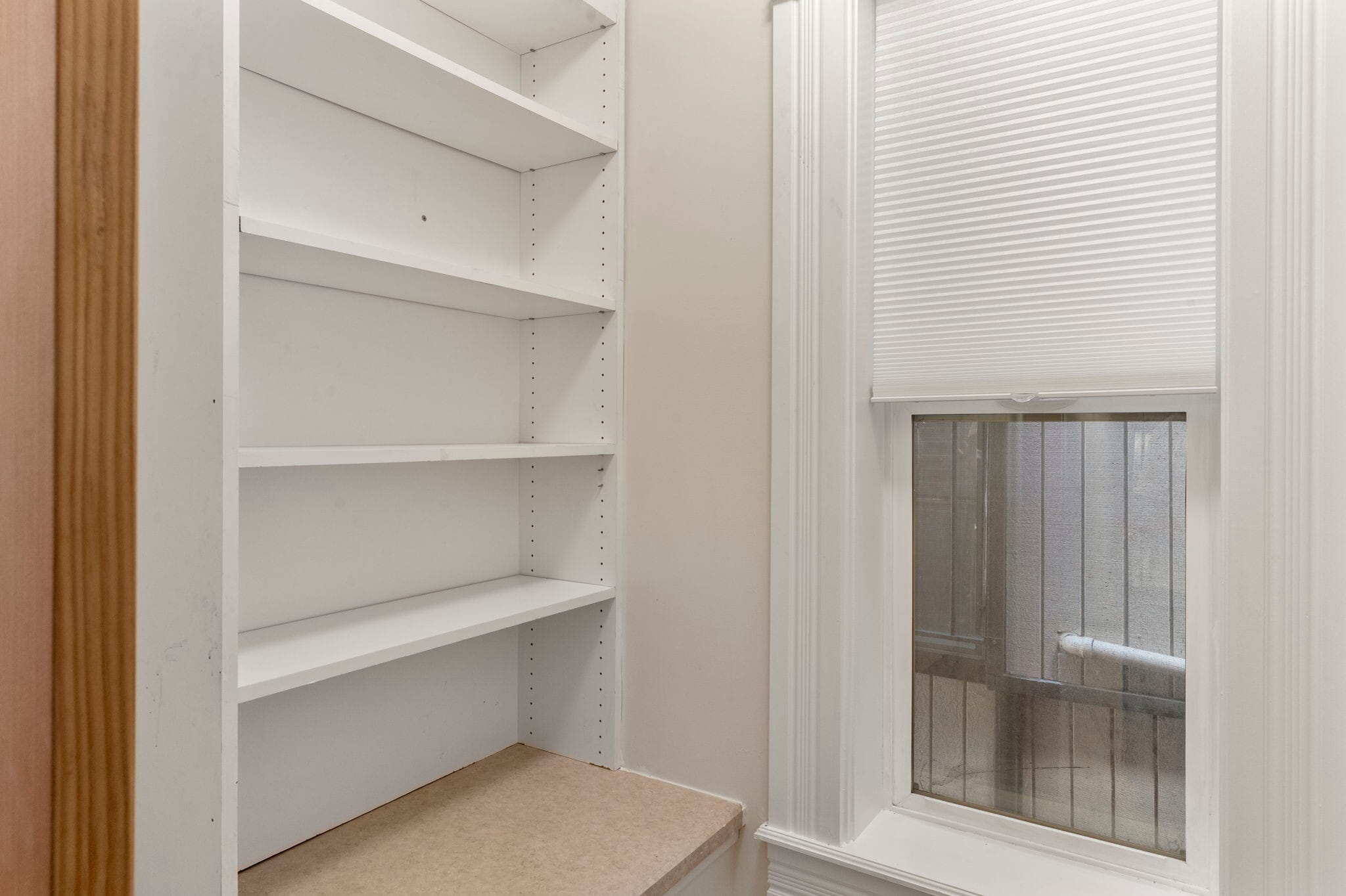 Walk-in pantry with built in shelving. - 3347 Tejon St