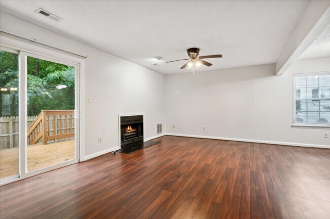 Spacious great room opens to the back deck & the fully fenced backyard! - 1644 Skiffes Creek Cir