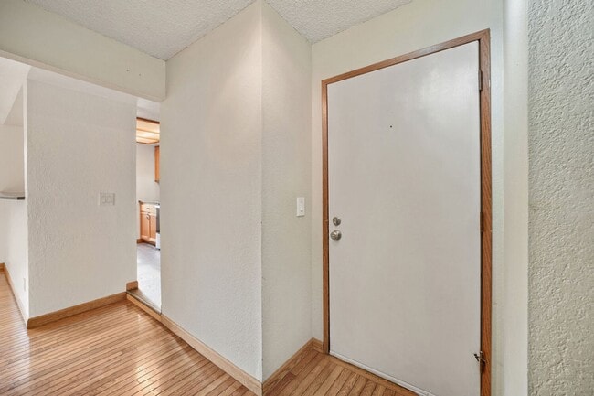 Building Photo - AVAILABLE NOW! 2BR/2BA Condo – Awesome Location! Glossy Hardwoods, Granite Countertops, W/S/G Inc...