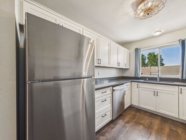 Building Photo - Updated 2 Bed / 1.5 Bath Townhome – In-Unit Washer & Dryer + Garage Parking – $2,700/month