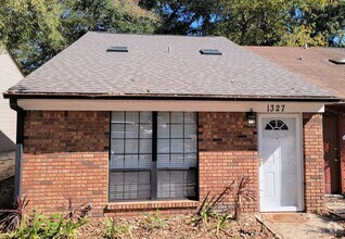 Building Photo - Updated 2 bedroom duplex with all wood flo...