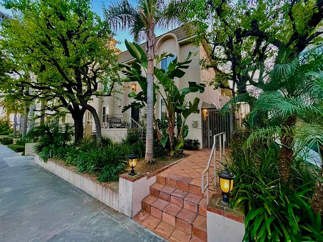 Gated Front Entrance with Tropical Foliage and 1 of 5 security cameras - 1325 Wellesley Ave