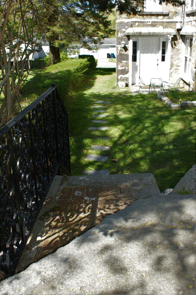 side path leading to extra parking in the back - 35 Coggeshall Ave