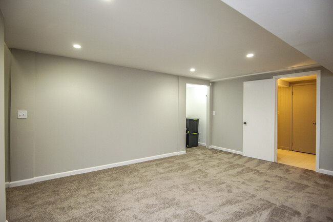 Photo 19. Lower level Family Room opening to second Bathroom and an alcove - 1623 Lethia Dr