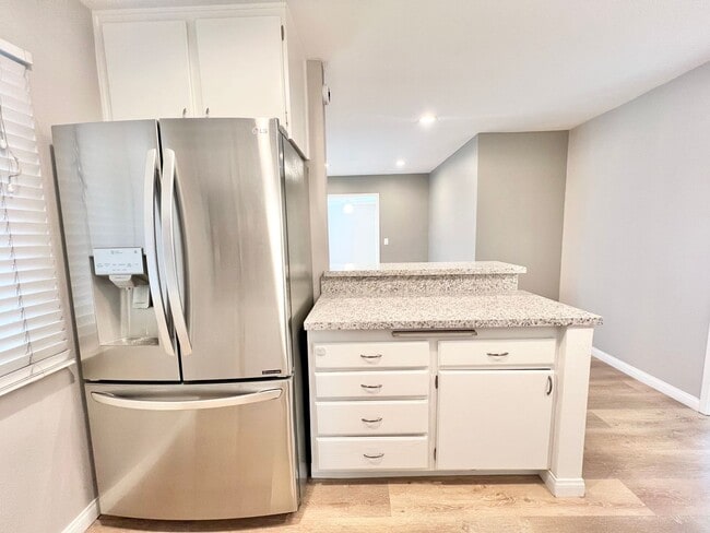 Building Photo - Contemporary 2 Bed Condo with 2 Garage Parking Spaces, Community Pool, and 3 Private Balconies