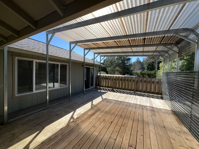 Building Photo - Newley updated 3-bedroom home features fenced yard, garage, and covered patios!