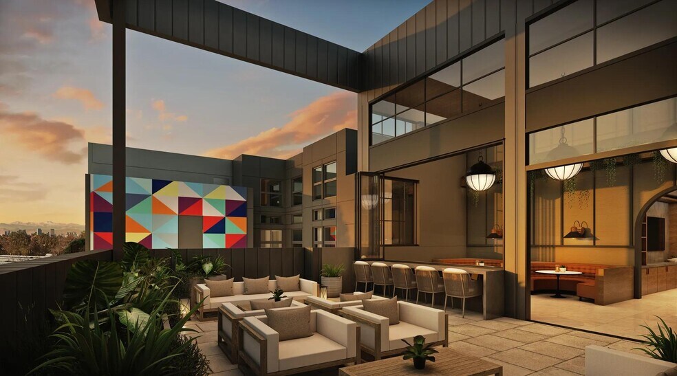 Rooftop deck with indoor/outdoor space showcasing stunning views. - Modera University Park