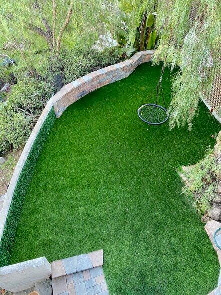 View down into the side yard from street level and patio - 3545 Bear Dr