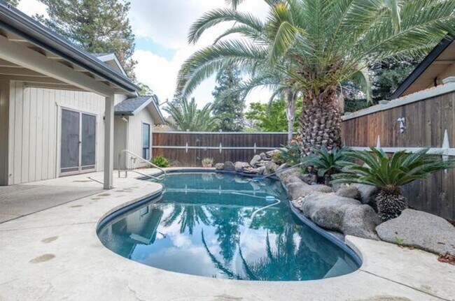 Building Photo - Drench Yourself in Luxury: 3-Bedroom Corner Oasis with a Sparkling Pool!