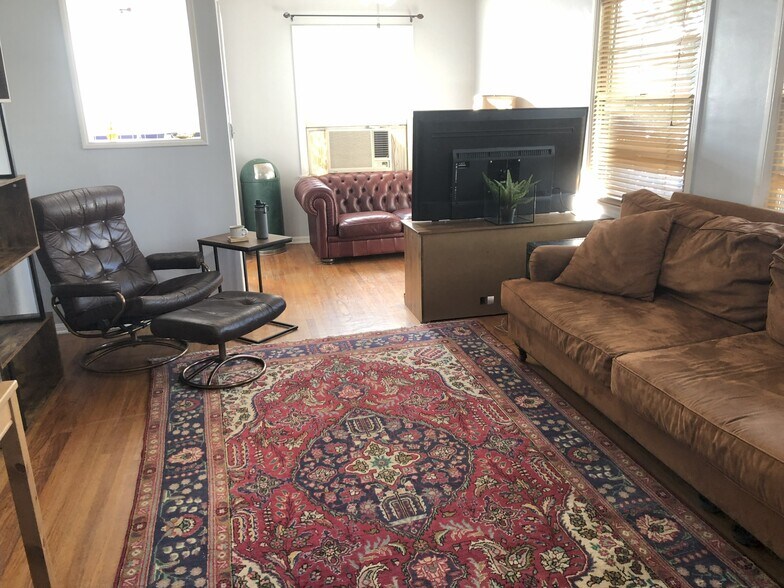 living room with media area - 902 Patterson Ave
