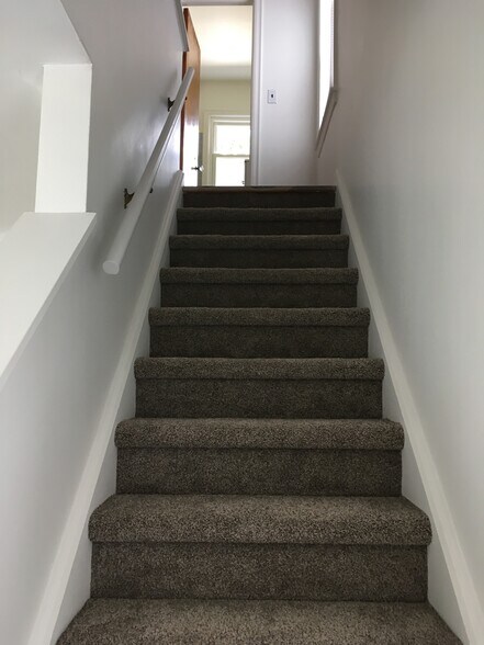 stairway to bedrooms and bath - 506 W Stadium Blvd