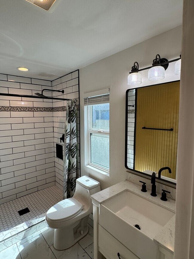 Building Photo - !! MOVE-IN SPECIAL !! Cozy Carson Back House with Skylights & Washer/Dryer