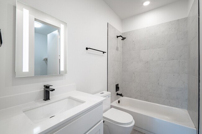 Building Photo - Gated Luxury Townhomes with yard + Roof Patio