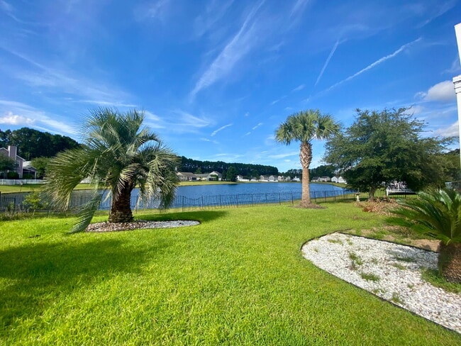 Building Photo - Three Bedroom Home with fenced-in Backyard oasis!