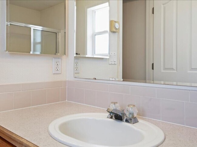 Building Photo - June Rent Free!!  Move Today!  Four Bedroom, Three Bath Home with Beautiful Backyard, Two Car Gar...