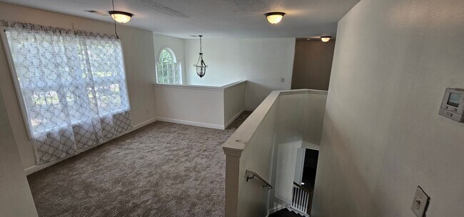 Building Photo - Commanding Curb Appeal, Conveniently Place