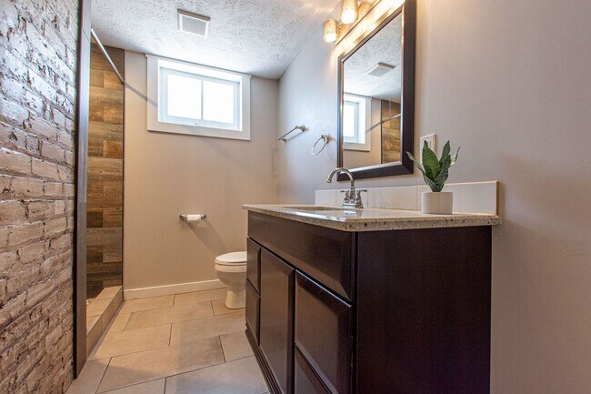 Building Photo - Adorable Brick 4 Bedroom Ranch with Finish...