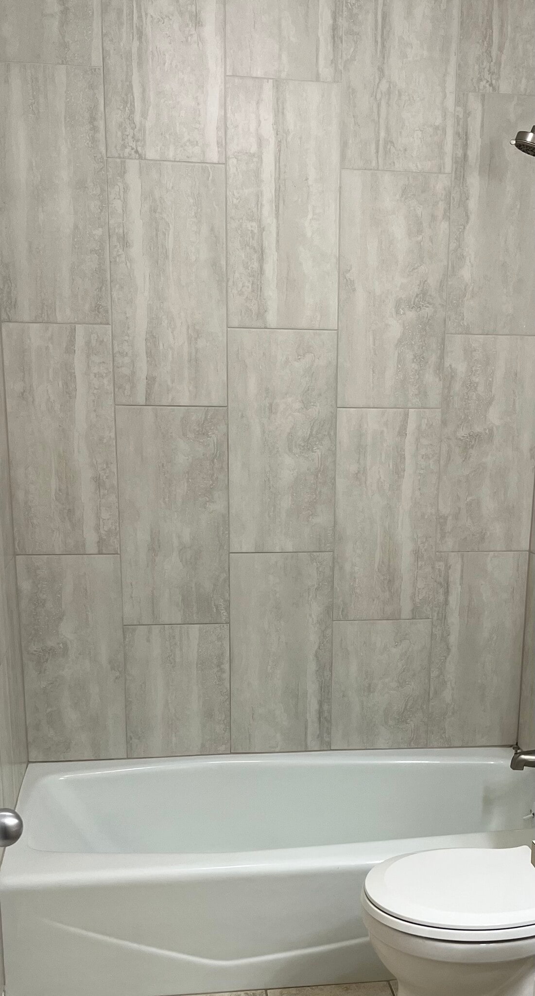 put in new ceramic tile in first floor shower/tub - 12063 Burdette Cir