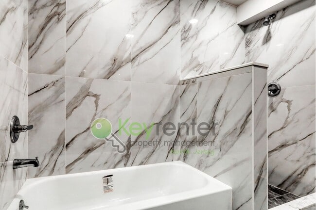 Building Photo - Modern New Construction 2 Bedroom Townhome with Garage & Driveway — First Occupancy!