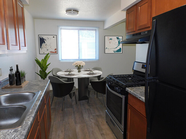 Kitchen and Dining Area with Natural Light - West Broadway Apartments