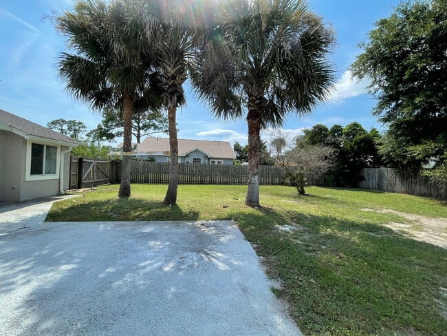Building Photo - "Charming 3-Bed Oasis with 2 Baths in Prime Panama City Beach Location – 1,423 Sq. Ft. of Serene ...
