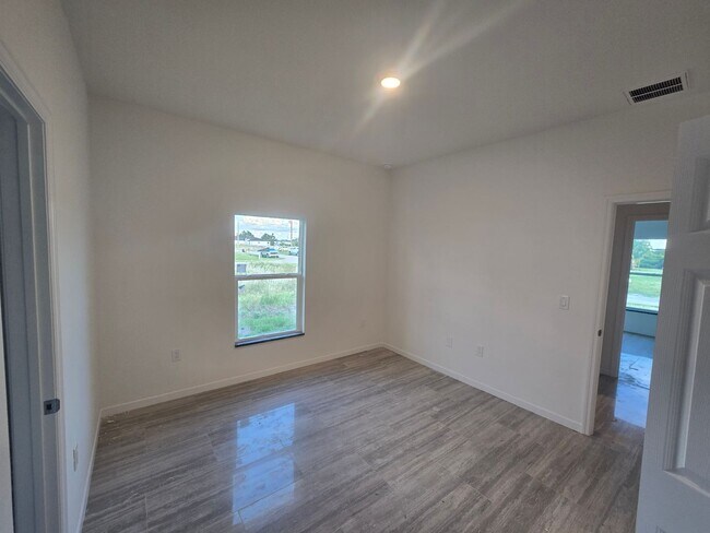 Building Photo - Brand New 2/2/1- Great SW Lehigh Acres Loc...