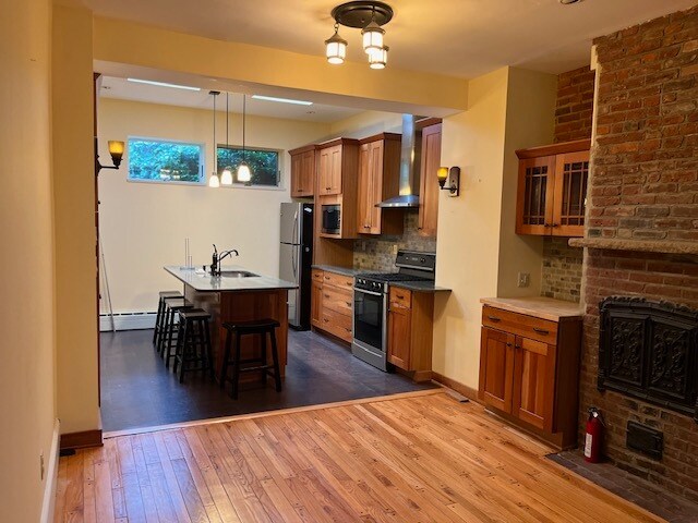 Kitchen-alcove with wood burning stove. - 726 N Bodine St