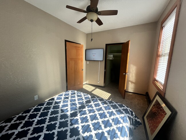 Bedroom #2 and the 43" smart TV, closet and door leading to hallway, closet door open - 3517 19th Ave S