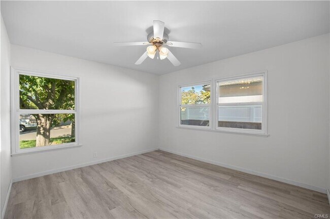 Building Photo - Welcome to this inviting 3 bedroom, 2 bath residence tucked away on a peaceful street in the hear...