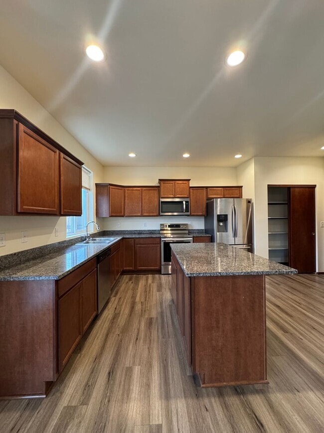 Building Photo - Spacious 5-Bedroom Home with Fenced Yard & Oversized Garage