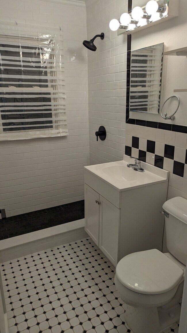 New Tile Shower with Black fixtures - 2144 Browning St