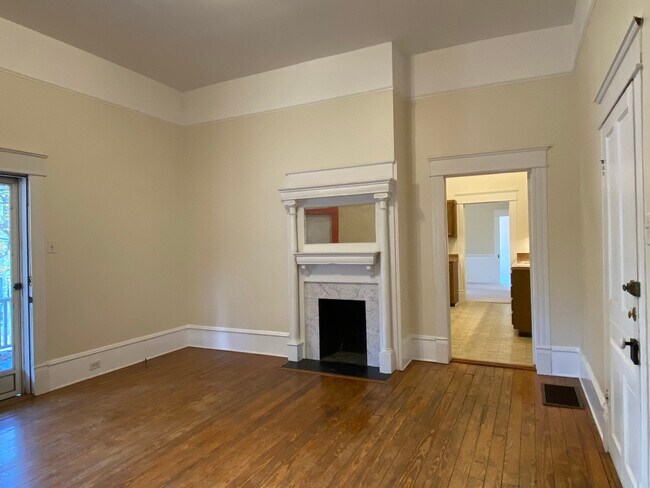 The view through the kitchen into the large office/study and the bedroom beyond. - 218 Linden Ave