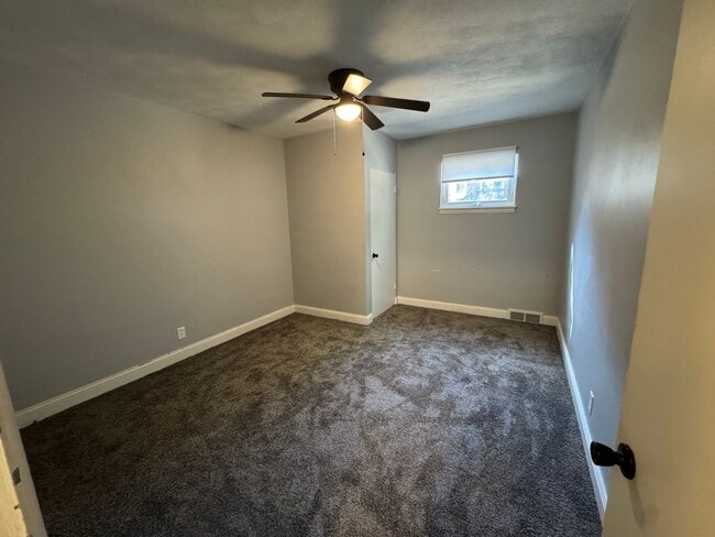 Building Photo - Large Moline Home with 3-Car Garage, Privacy, and Plenty of Space