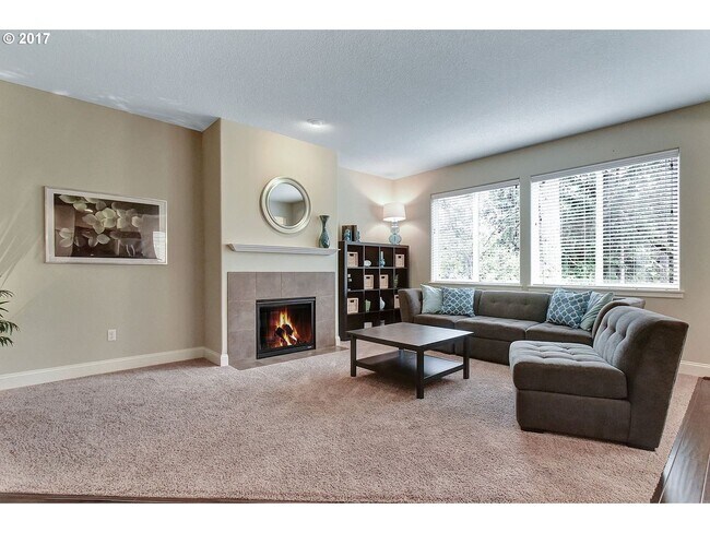 Building Photo - Bright and Open Floor Plan with Fireplace, Attached Garage & Vaulted Ceilings
