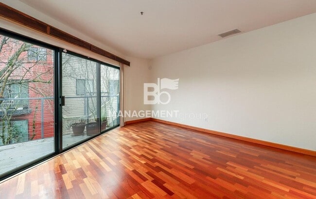 Building Photo - Spacious Riverfront Condo- Beautiful Condo w/River View from Bedroom! Parking Included!