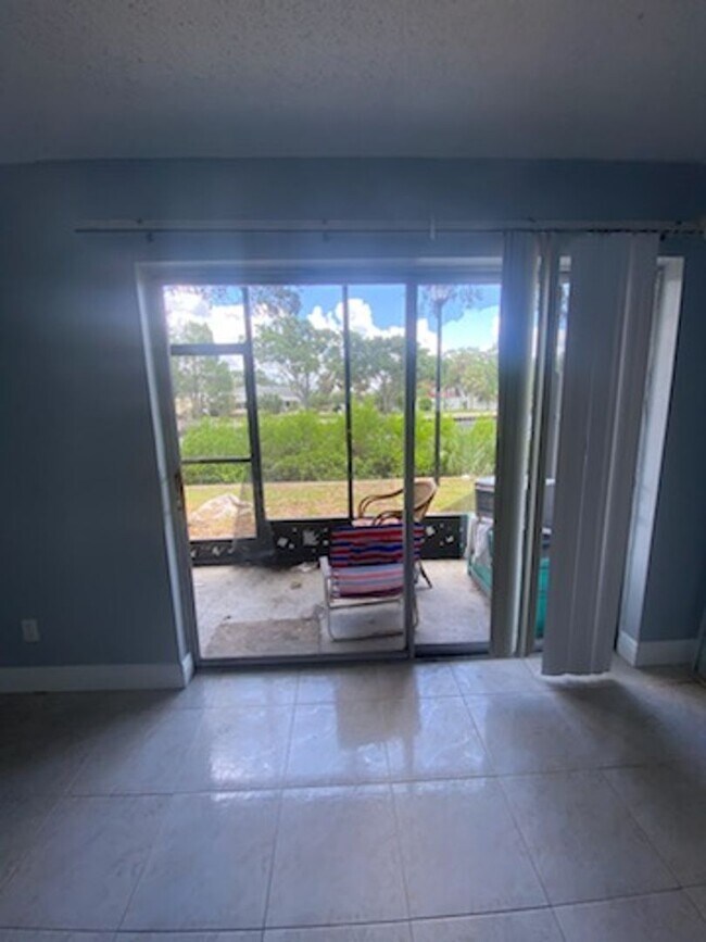 Building Photo - Beautiful water view ground floor condo in...